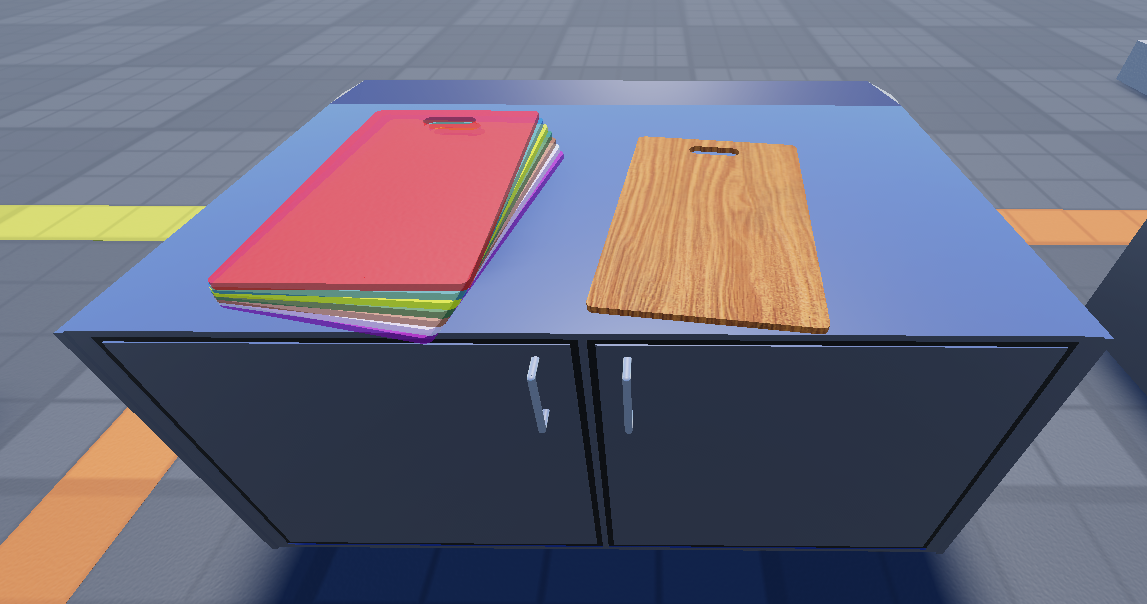 Chopping boards for food preparation, the wooden one for lower skilled users, the food specific colourful ones for higher skilled users